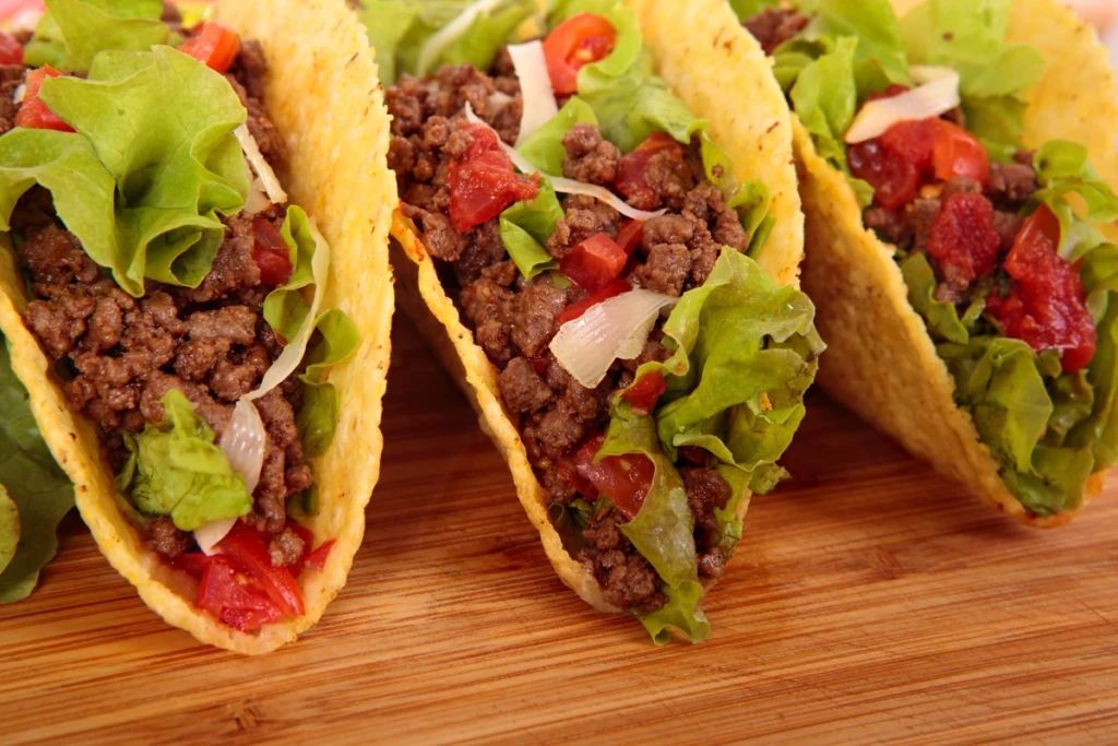 Traditional Mexican tacos de lengua with tender beef tongue and corn tortillas.