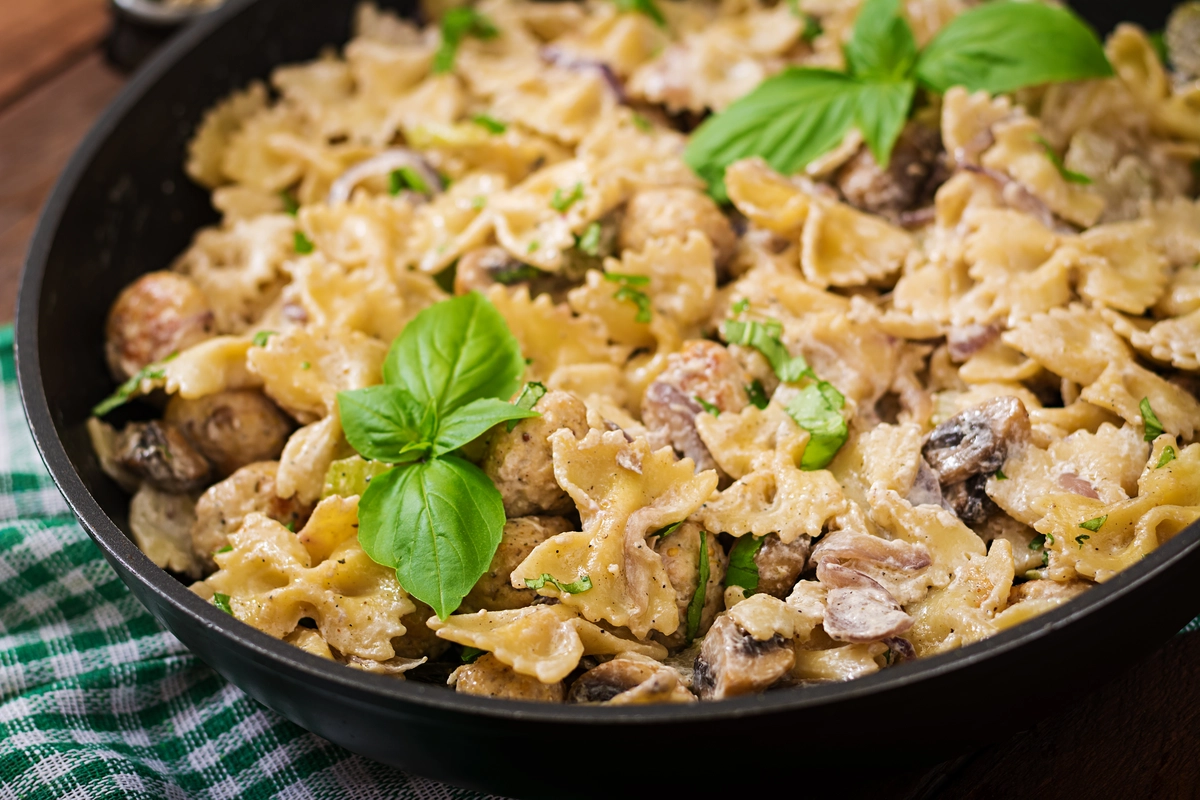 Barilla Protein Pasta served in a bowl with vegetables and sauce.