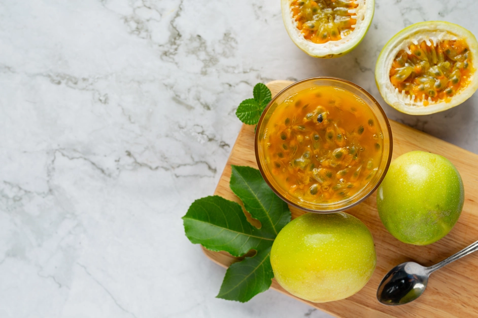 A tropical drink made by mixing passion fruit juice, pineapple juice, and coconut water, served in a tall glass.