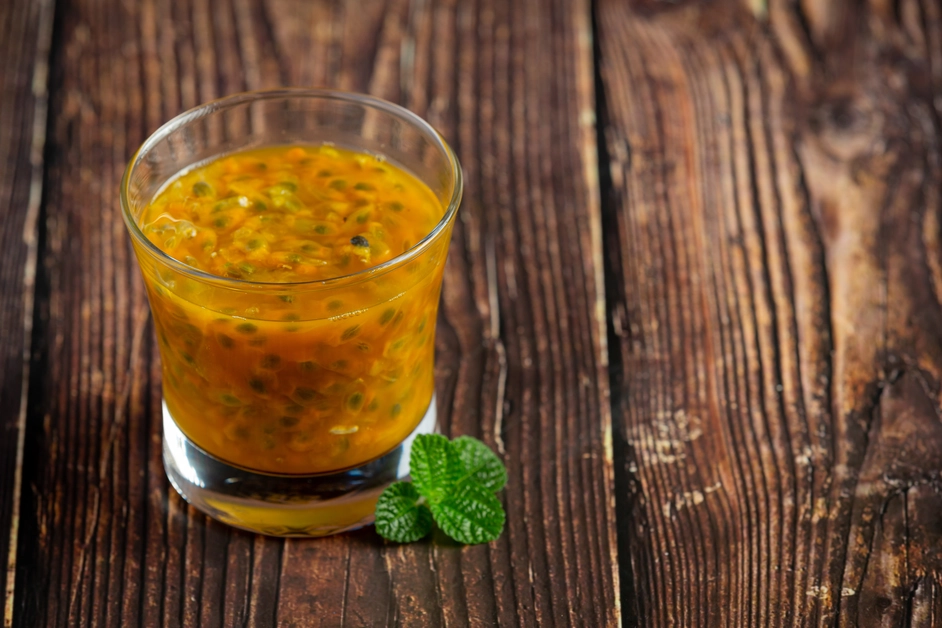  Fresh passion fruits cut open to reveal the juicy pulp and seeds.