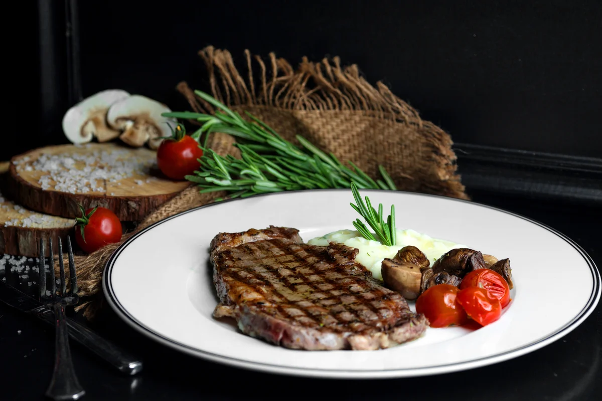 A detailed steak cooking chart showing different internal temperatures for various doneness levels, from rare to well-done, for different steak cuts.